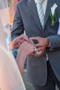 Bride and groom exchanging wedding rings. Stylish couple official ceremony Royalty Free Stock Photo