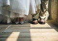 Bride and Groom Feet Standing on Wooden Floor