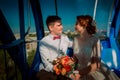 Bride and groom in the Ferris wheel Royalty Free Stock Photo