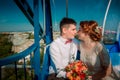 Bride and groom in the Ferris wheel Royalty Free Stock Photo