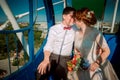 Bride and groom in the Ferris wheel Royalty Free Stock Photo