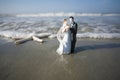 Bride and Groom Figurine on the Beach