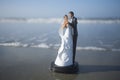 Bride and Groom Figurine on the Beach