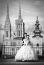 Bride and groom in front of cathedral bw