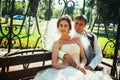 The bride and groom in the gazebo in the park