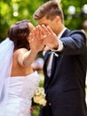 Bride and groom giving flower outdoor