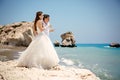 Bride and groom with glasses of champagne on the beach Mediterranean Sea Royalty Free Stock Photo