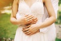 Bride and groom hands close up in the sunny day in the park Royalty Free Stock Photo