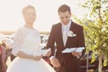 Bride and groom having fun and posing with Sweet Love letters in sunlight Royalty Free Stock Photo