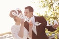 Bride and groom having fun and posing with Sweet Love letters in sunlight Royalty Free Stock Photo