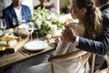 Bride and Groom Having Meal with Friends at Wedding Reception