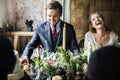 Bride and Groom Having Meal with Friends at Wedding Reception