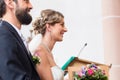 Bride and groom having wedding in church at altar Royalty Free Stock Photo