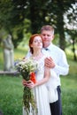 Bride and groom hold each other hands while they walk along the Royalty Free Stock Photo