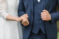 The bride and groom hold each other`s hands, close-up Royalty Free Stock Photo