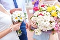 Bride and groom hold glasses of champagne and a bouquet on their wedding day Royalty Free Stock Photo