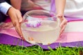 Bride and groom holding aquarium with goldfish