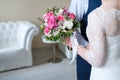 Bride and groom holding bridal bouquet close-up. Royalty Free Stock Photo