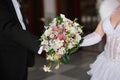 Bride and groom holding bridal bouquet close up Royalty Free Stock Photo