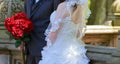 Bride and groom holding bridal bouquet Royalty Free Stock Photo