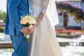 Bride and groom holding bridal bouquet close up Royalty Free Stock Photo