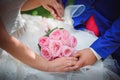 Bride and groom holding bridal bouquet close up Royalty Free Stock Photo