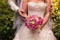 Bride and groom holding bridal bouquet close up Royalty Free Stock Photo