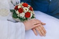 Bride and groom holding bridal bouquet close up Royalty Free Stock Photo