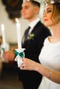 Bride and groom holding candles in church Royalty Free Stock Photo