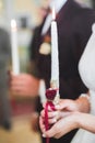 Bride and groom holding candles in church Royalty Free Stock Photo