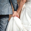 Bride and groom holding hands