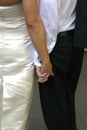 Bride and groom holding hands