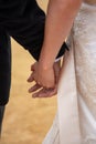 Bride and groom holding hands