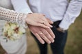 Bride and groom holding hands outdoors,  wedding theme Royalty Free Stock Photo