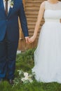 Bride and groom holding hands