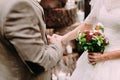 Bride and groom holding hands during a wedding ceremony. Outdoor Royalty Free Stock Photo