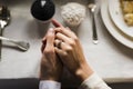 Bride and Groom Holding Hands on Wedding Reception Royalty Free Stock Photo