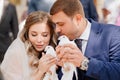 The bride and groom are holding a pair of white pigeons. Royalty Free Stock Photo