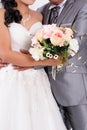 Bride with groom holding wedding bouquet at ceremony Royalty Free Stock Photo