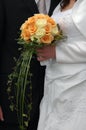 Bride and groom holding wedding bouquet Royalty Free Stock Photo