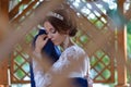 Bride and groom huggin insude summer house Royalty Free Stock Photo