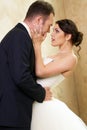 Bride and groom hugging in empty room