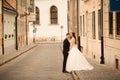 Bride and groom hugging in the old town street. Weding couple in love. Weeding in Budapest Royalty Free Stock Photo