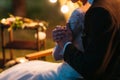 Bride and groom hugs in soft evening lights