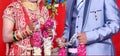 Bride and groom at the Indian wedding garlands or Jaimala ceremony