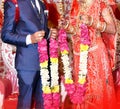 Bride and groom at the Indian wedding garlands or Jaimala ceremony