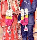 Bride and groom at the Indian wedding garlands or Jaimala ceremony