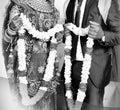 Bride and groom at the Indian wedding garlands or Jaimala ceremony