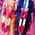 Bride and groom at the Indian wedding garlands or Jaimala ceremony