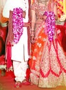 Bride and groom at the Indian wedding garlands or Jaimala ceremony